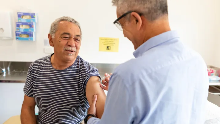 Older man getting a vaccine